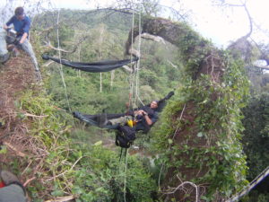 Man relaxing in his hammock high in the jungle canopy