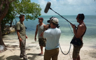an image of a film crew working on paradise island