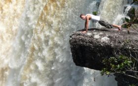 an image of a man doing press-ups at Guyana's sizeable waterfall during a Bushmasters expedition
